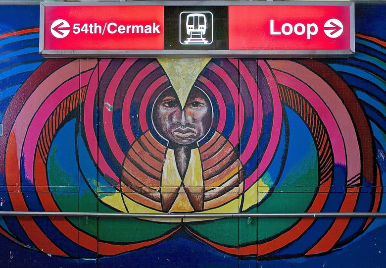 A vibrant mural at the 18th Street Pink Line L Stop in Pilsen, featuring colorful artwork.